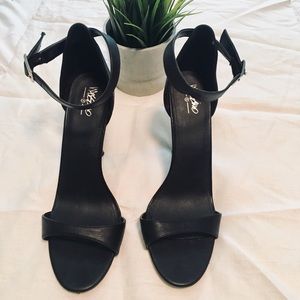 Black faux leather heels